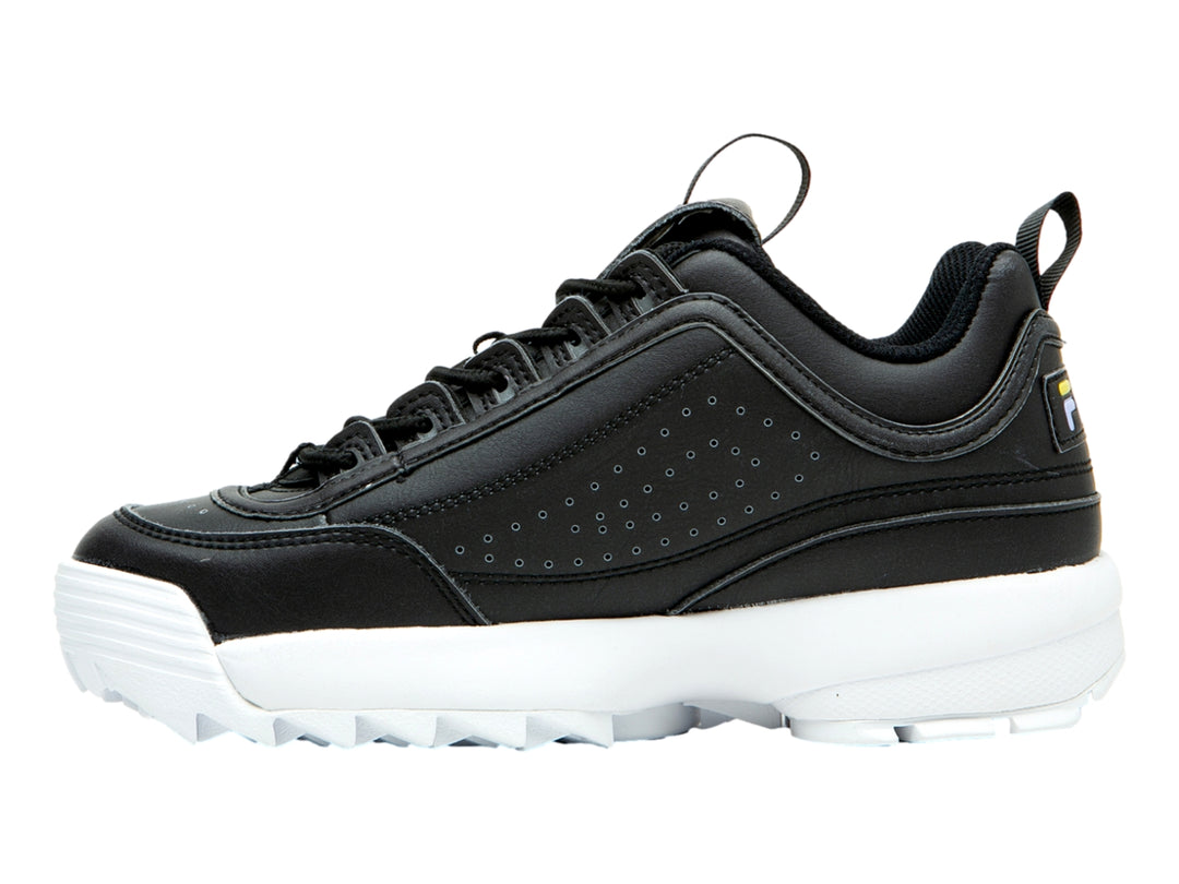 Tenis FILA Disruptor II color negro con suela blanca gruesa y dentada.