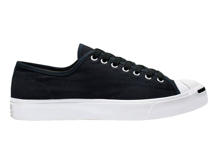 Tenis Converse Jack Purcell de color negro con suela y punta blanca, vista lateral.