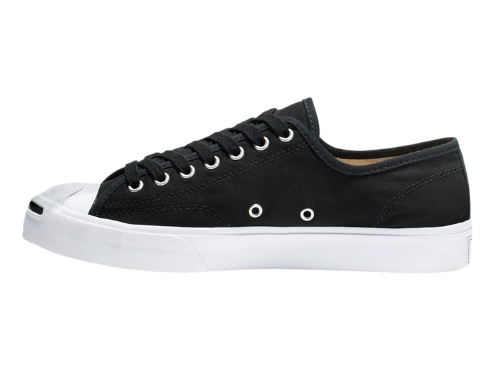 Tenis Converse Jack Purcell de color negro con suela y punta blanca, vista lateral.