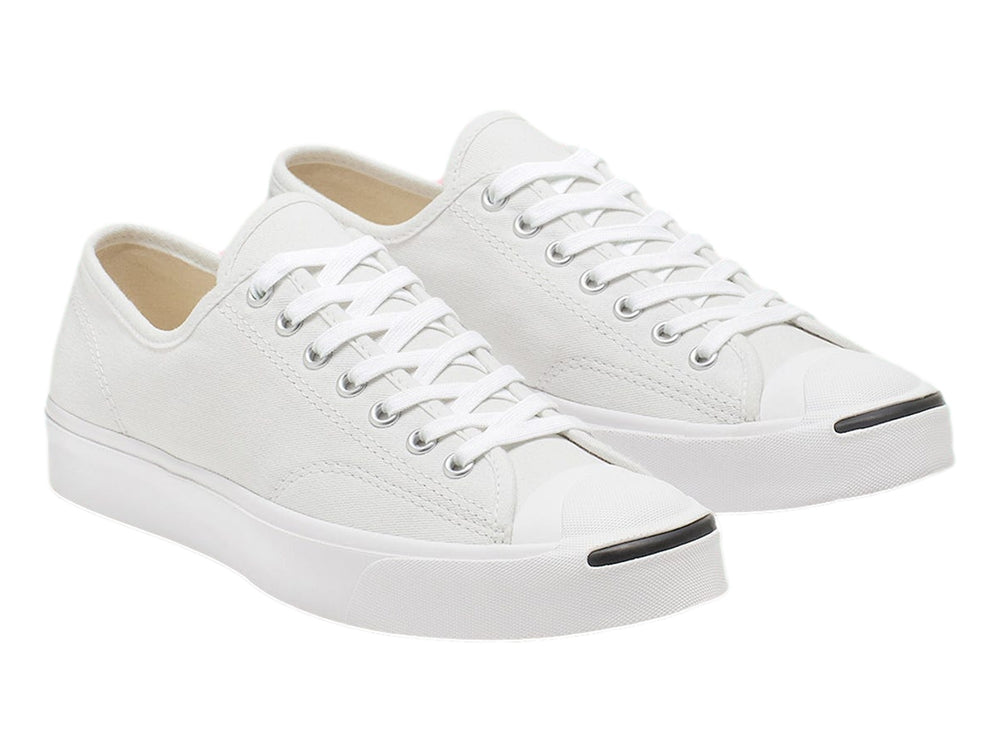 Tenis Converse Jack Purcell blancos de lona con suela blanca y punta redondeada.
