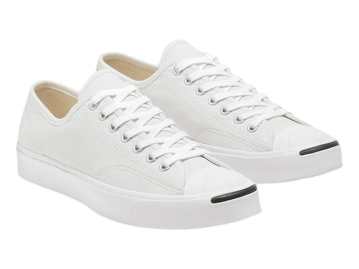 Tenis Converse Jack Purcell blancos de lona con suela blanca y punta redondeada.