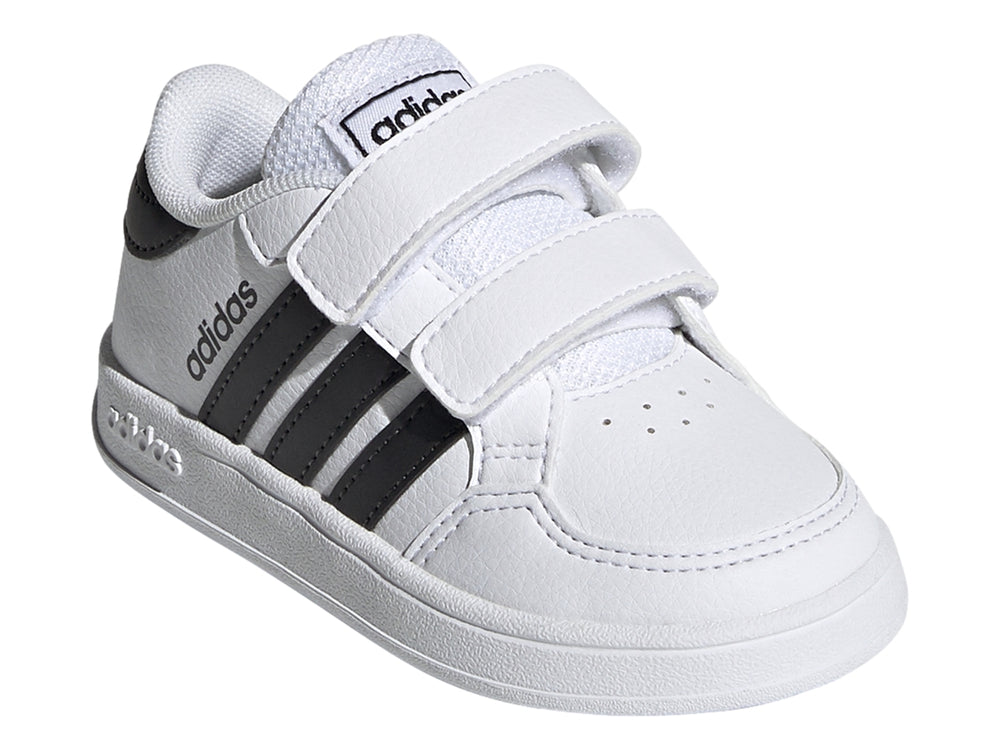 Tenis Adidas Breaknet I para niño en color blanco con tres franjas negras y cierre de velcro.