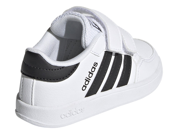 Tenis Adidas Breaknet I para niño en color blanco con tres franjas negras y cierre de velcro.