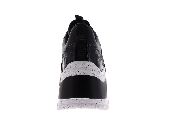 Tenis Westies modelo We Gelsen en color negro con suela blanca de plataforma y detalle de estampado animal.