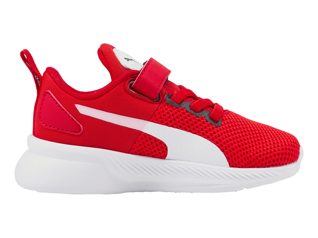 Tenis deportivos PUMA infantiles en color rojo con suela blanca y correa de velcro.