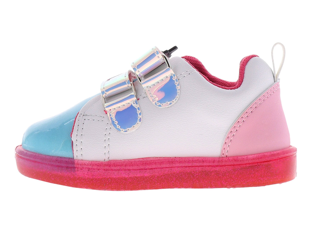 Zapato deportivo infantil multicolor con diseño de unicornio, arcoíris y suela rosa brillante.
