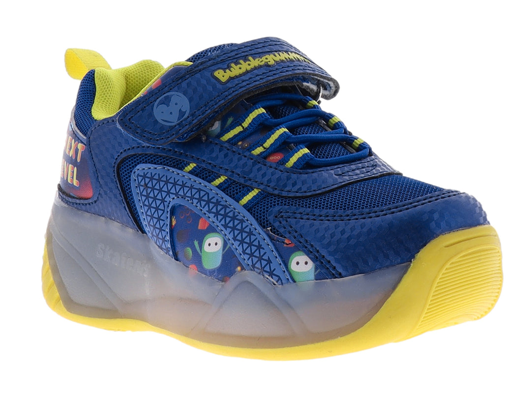 Tenis deportivos infantiles color azul y amarillo con detalles multicolores y suela gris translúcida.