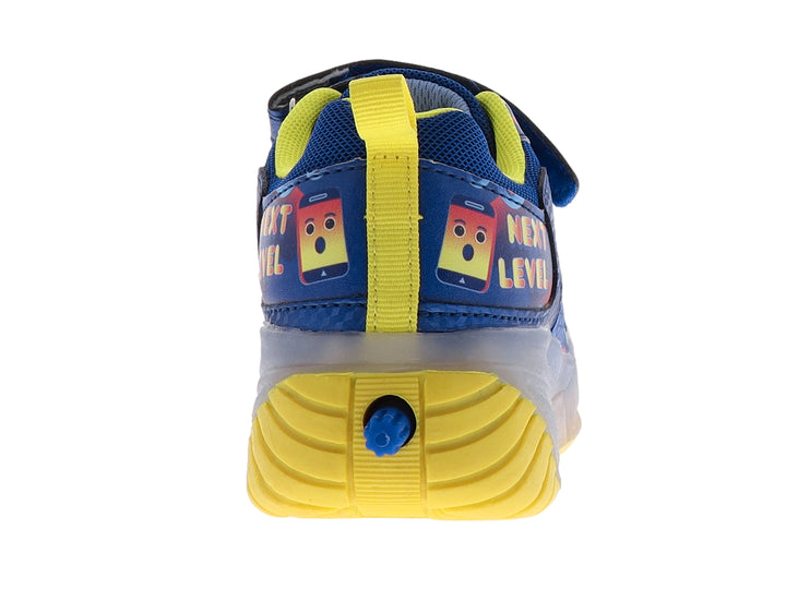 Tenis deportivos infantiles color azul y amarillo con detalles multicolores y suela gris translúcida.