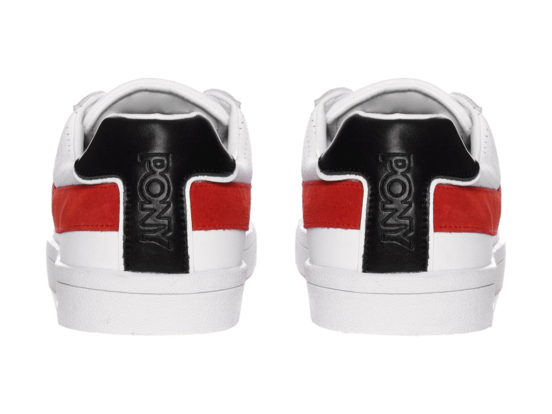 Tenis PONY blancos con franja roja lateral y detalle negro en el talón.