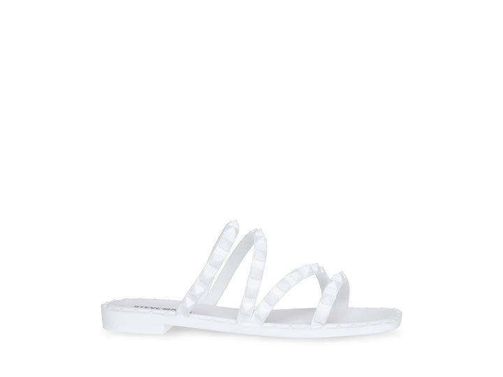 Sandalia blanca de Steve Madden con correas frontales decoradas con bordes dentados y suela plana.