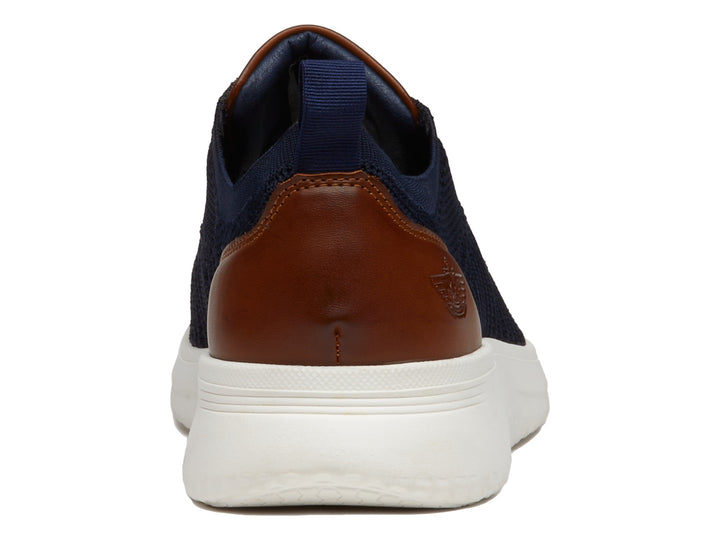 Zapato casual Dockers color marino con detalles en café y suela blanca.