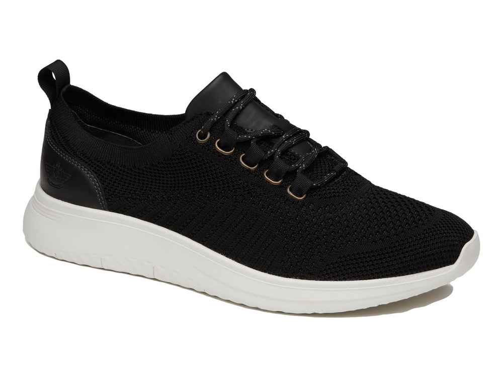 Zapato casual Dockers color negro con suela blanca y tejido transpirable.