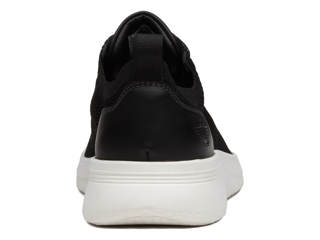 Zapato casual Dockers color negro con suela blanca y tejido transpirable.