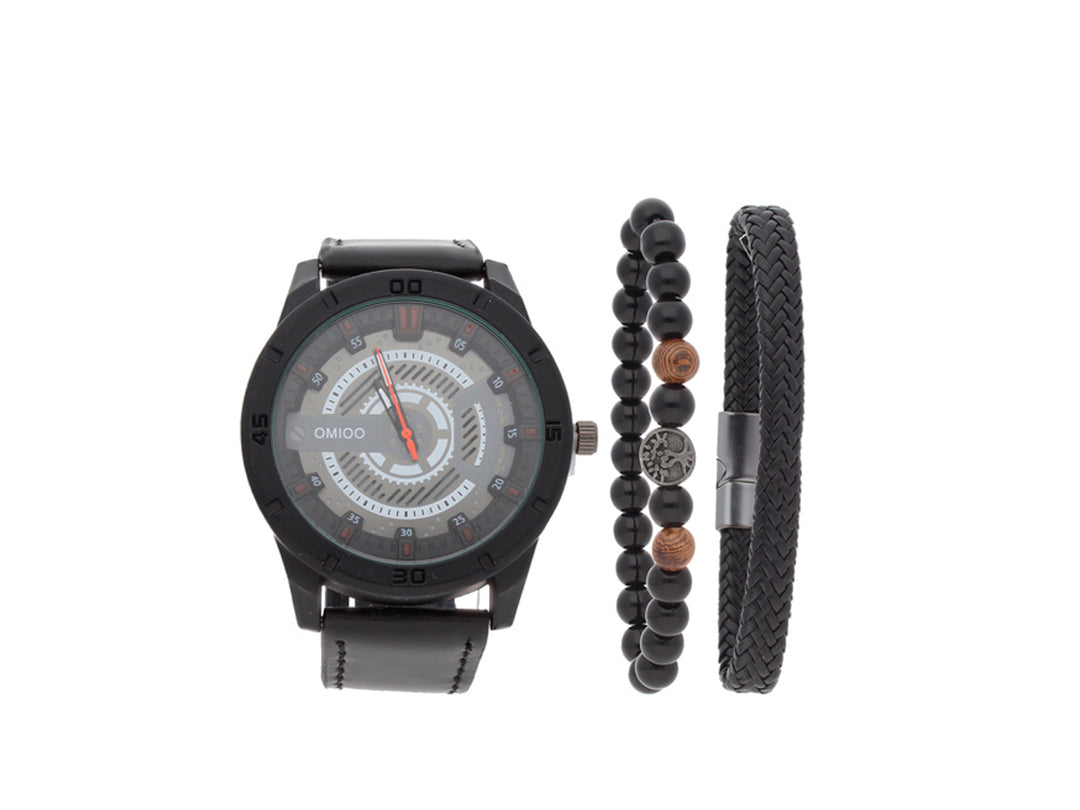Set de accesorios compuesto por un reloj negro con correa de cuero y dos pulseras negras coordinadas.