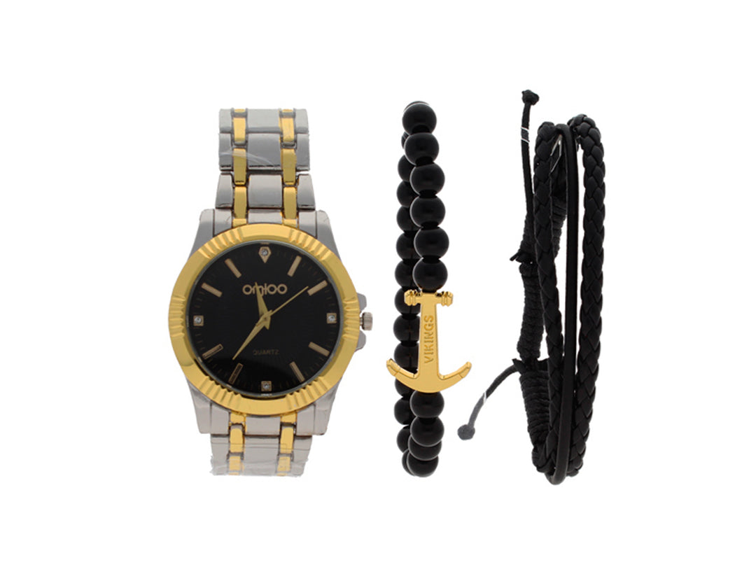 Set de accesorios compuesto por un reloj plateado y dorado con esfera negra y dos pulseras negras.