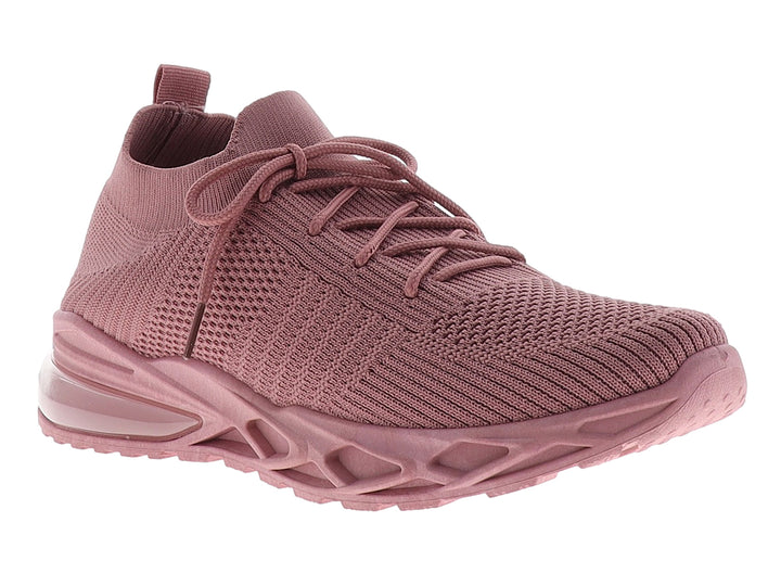 Tenis deportivos para mujer en color rosa con tejido transpirable y suela gruesa.