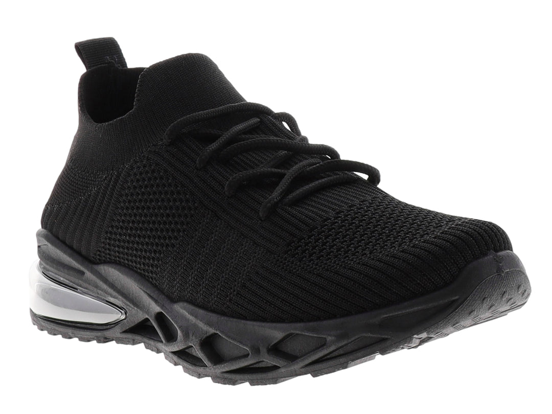 Tenis deportivos color negro con suela gruesa y tejido transpirable.