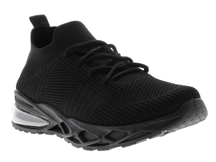 Tenis deportivos color negro con suela gruesa y tejido transpirable.