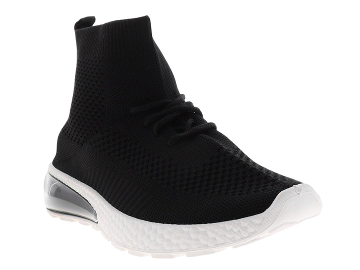 Tenis deportivos negros estilo calcetín con suela blanca y cámara de aire en el talón.