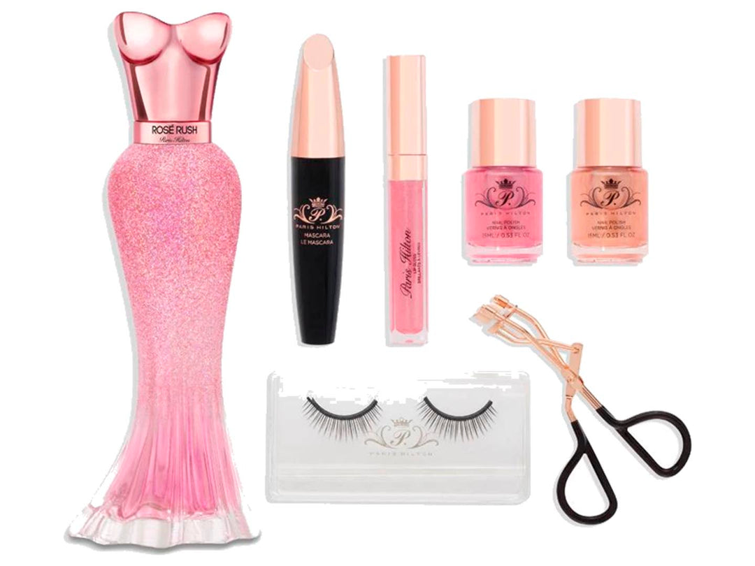 Set de regalo Paris Hilton Rosé Rush que incluye perfume, esmaltes, rímel, gloss y pestañas en estuche rosa.