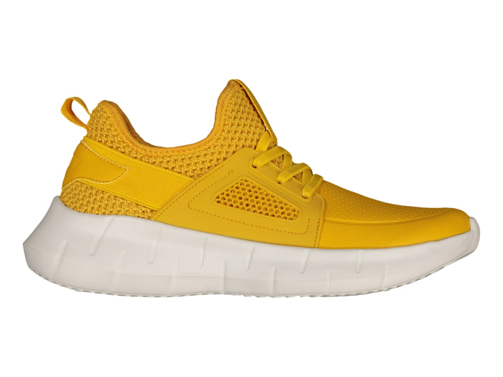 Tenis deportivos Charly color amarillo con suela blanca gruesa.