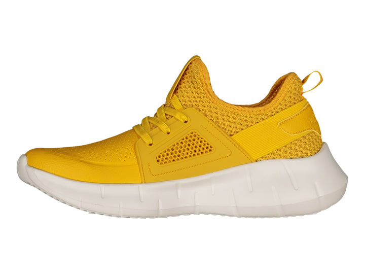 Tenis deportivos Charly color amarillo con suela blanca gruesa.