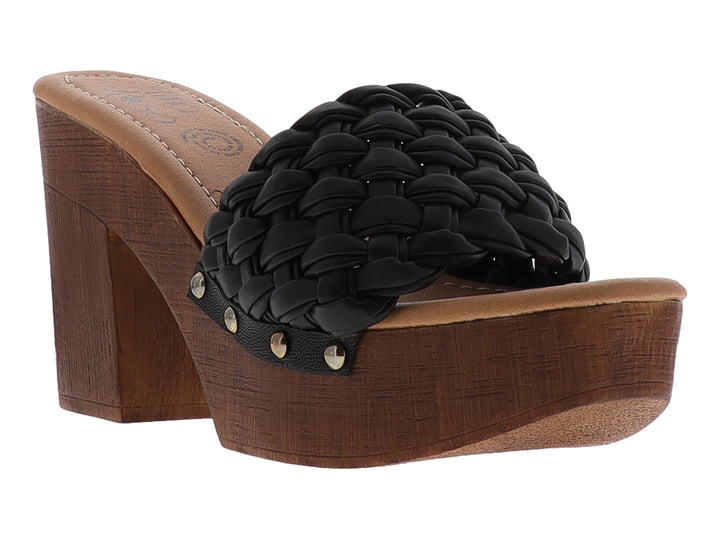 Sandalia negra con correa trenzada y tacón grueso de plataforma color madera.