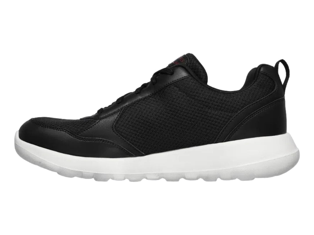 Tenis deportivos Skechers para hombre en color negro con suela blanca y detalles sintéticos.