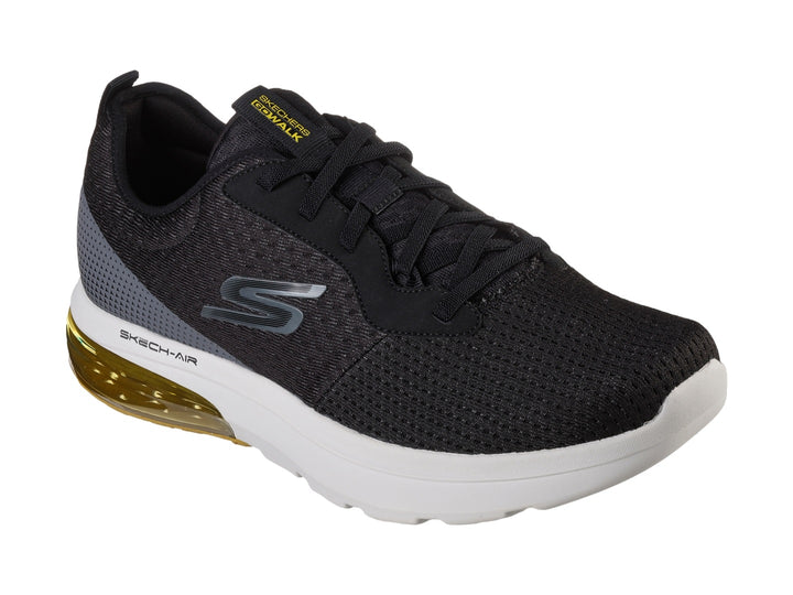 Tenis deportivos Skechers color negro con suela blanca y amortiguación amarilla en el talón.