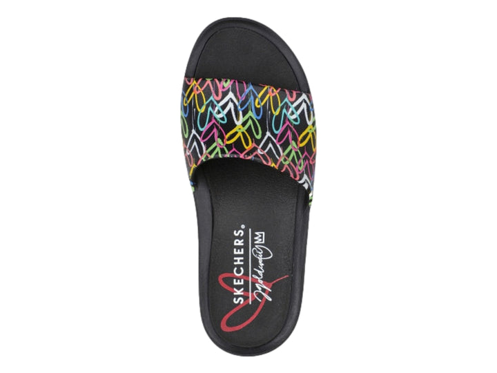 Sandalia Skechers negra para mujer con estampado multicolor estilo grafiti en la banda superior.