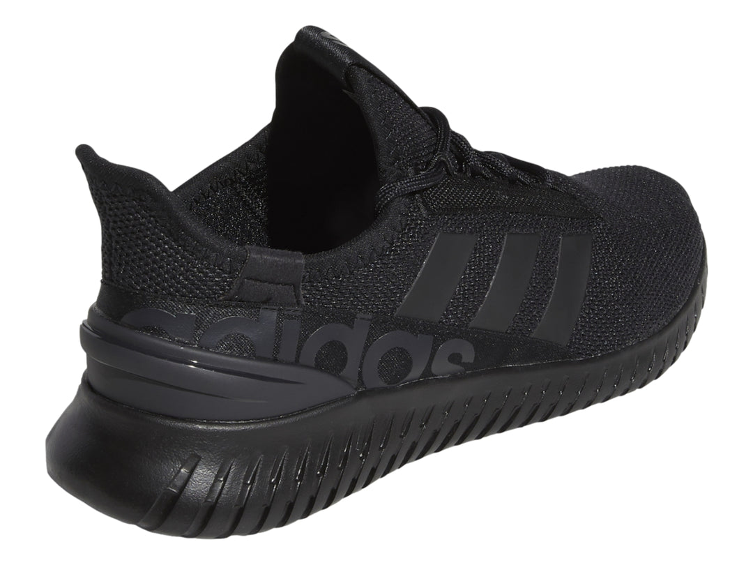 Tenis deportivos Adidas Kaptir 2.0 en color negro, vista lateral sobre fondo blanco.