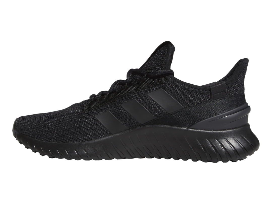 Tenis deportivos Adidas Kaptir 2.0 en color negro, vista lateral sobre fondo blanco.