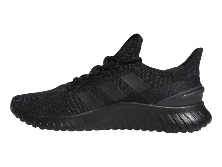 Tenis deportivos Adidas Kaptir 2.0 en color negro, vista lateral sobre fondo blanco.