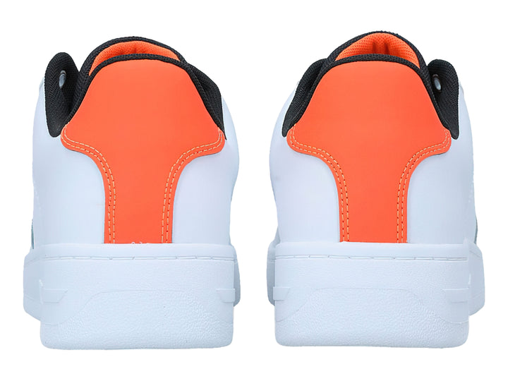 Tenis blancos Tommy Hilfiger con detalles en naranja y negro, diseño deportivo de corte bajo.