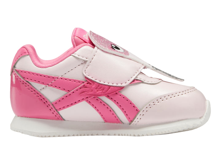 Tenis Reebok para bebé en colores rosa pálido y rosa intenso con cierre de velcro y suela blanca.