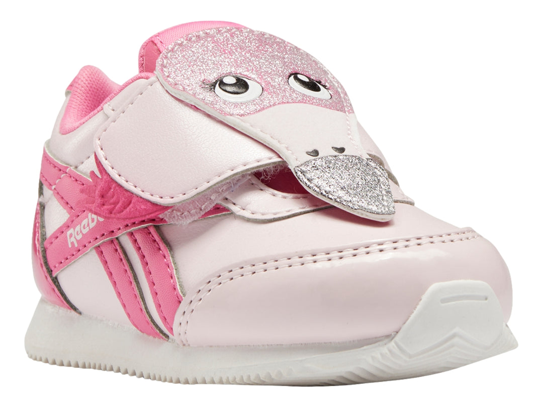 Tenis Reebok para bebé en colores rosa pálido y rosa intenso con cierre de velcro y suela blanca.