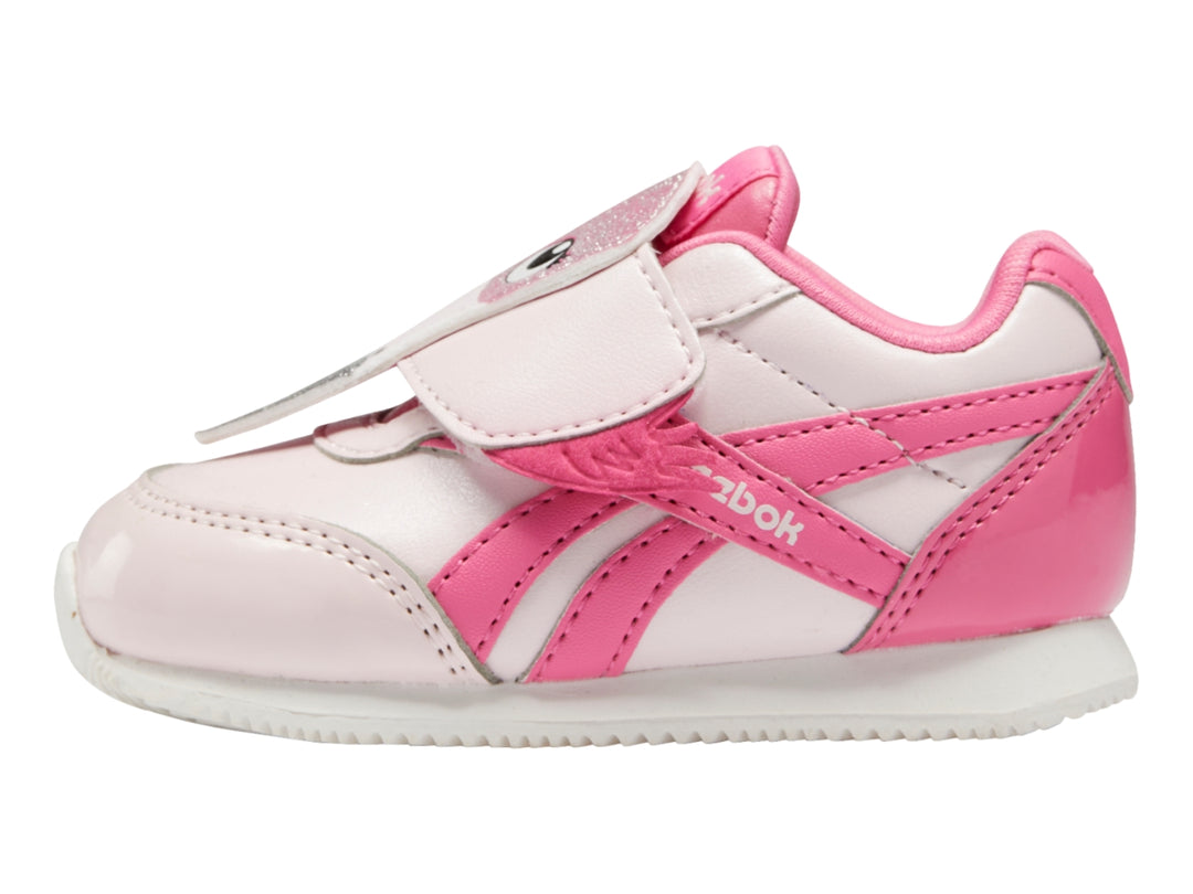 Tenis Reebok para bebé en colores rosa pálido y rosa intenso con cierre de velcro y suela blanca.
