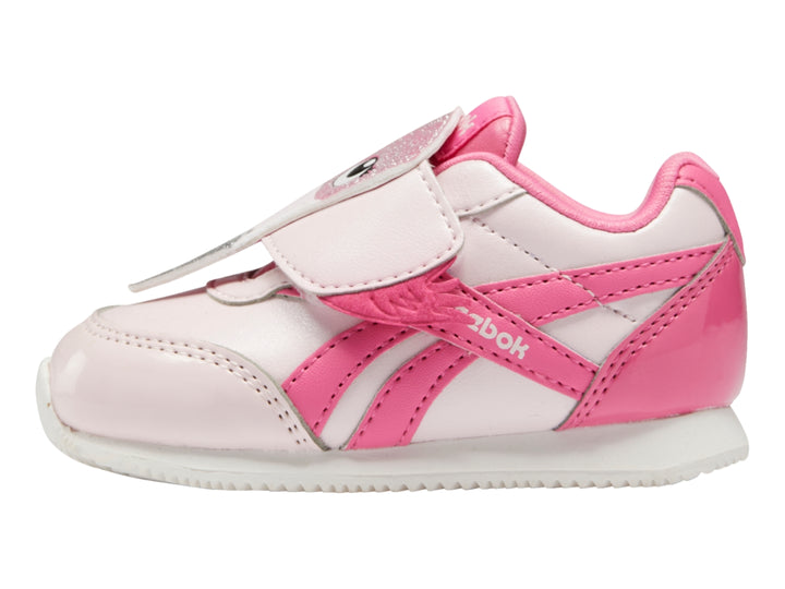 Tenis Reebok para bebé en colores rosa pálido y rosa intenso con cierre de velcro y suela blanca.