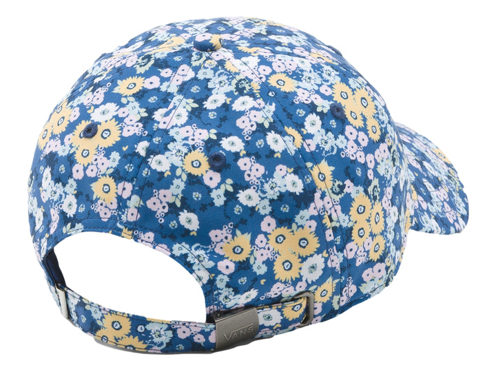 Gorra Vans azul con estampado de flores amarillas y rosas en tonos pastel y logotipo blanco al frente.