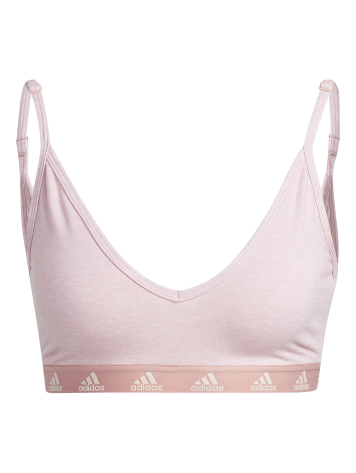 Bra deportivo Adidas en color rosa claro con tirantes delgados y banda elástica inferior blanca.