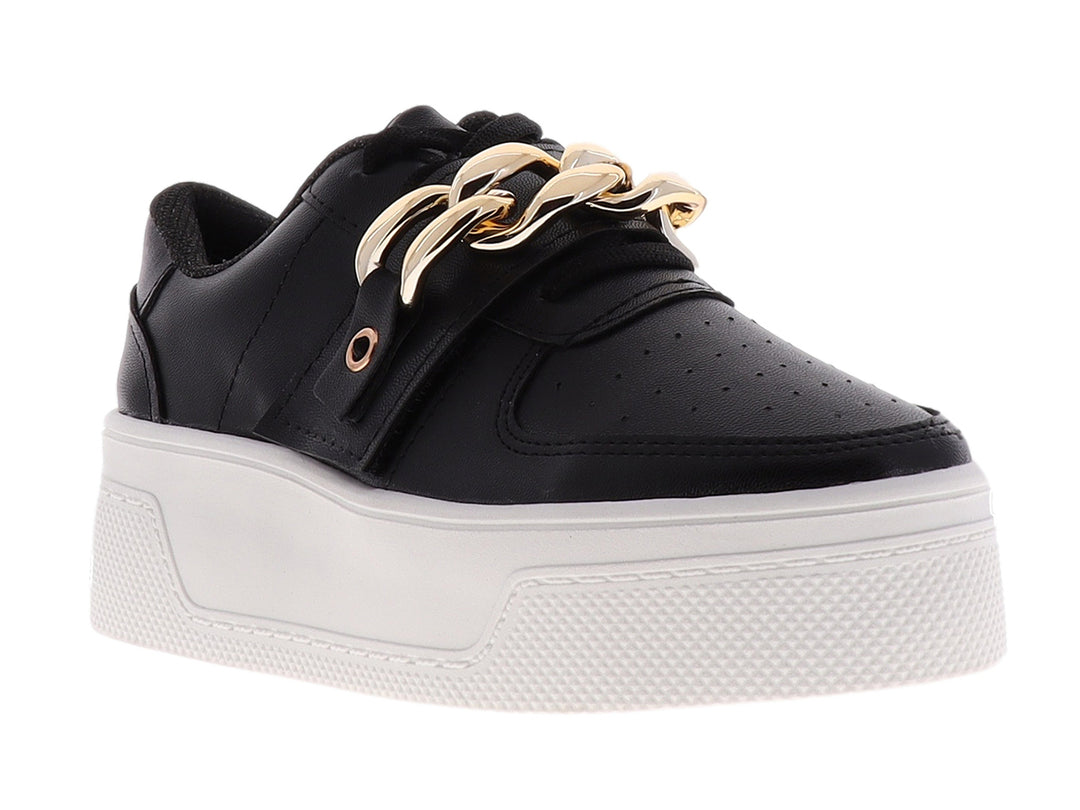 Tenis negros de plataforma con suela blanca y detalle de cadena dorada en la parte superior.