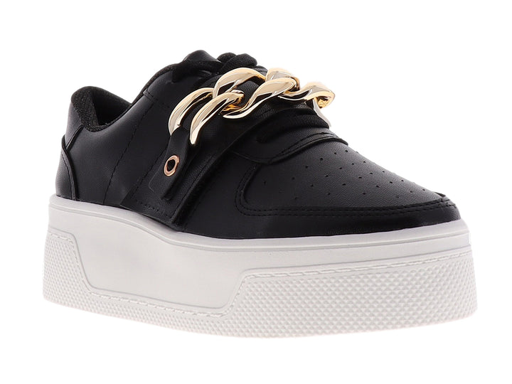 Tenis negros de plataforma con suela blanca y detalle de cadena dorada en la parte superior.
