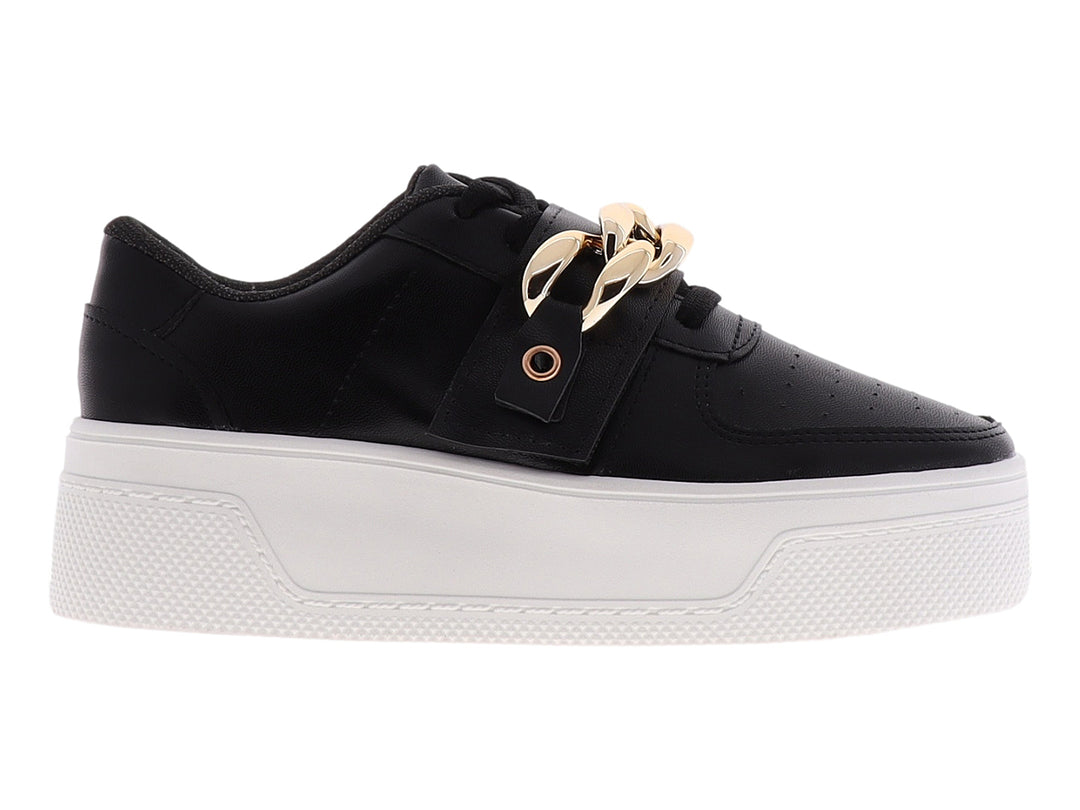 Tenis negros de plataforma con suela blanca y detalle de cadena dorada en la parte superior.