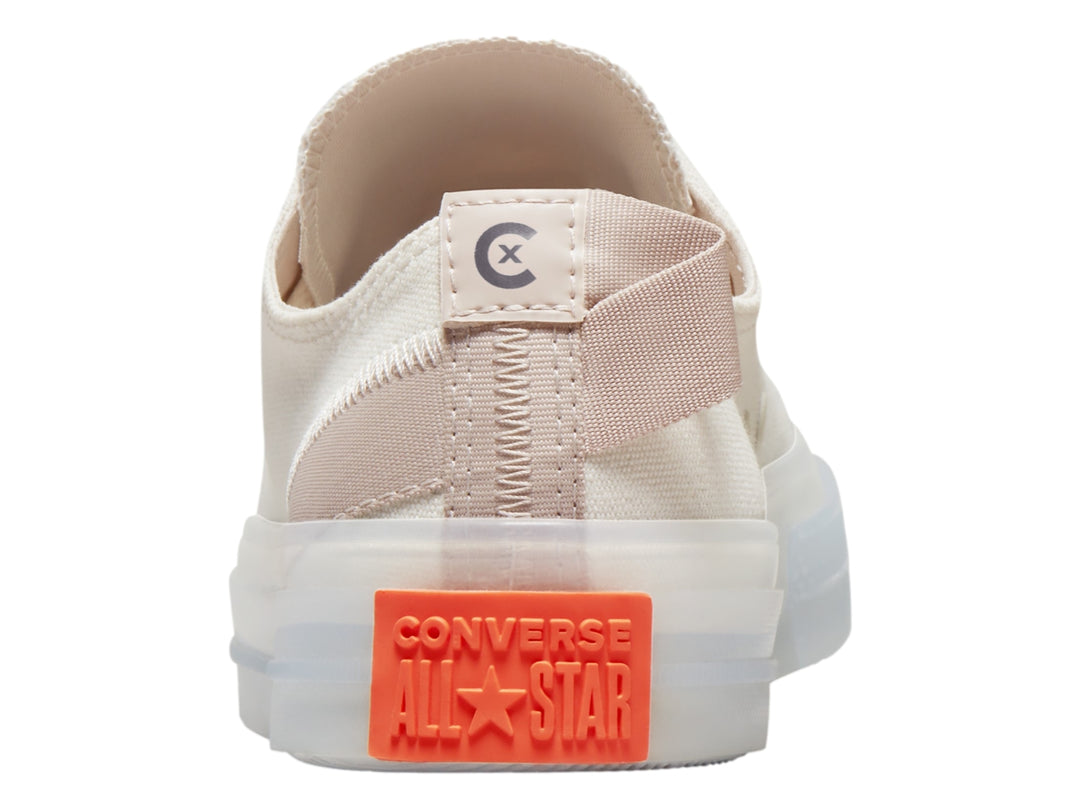 Tenis Converse Chuck Taylor All Star CX de color blanco y beige con suela gruesa y detalle naranja en el talón.