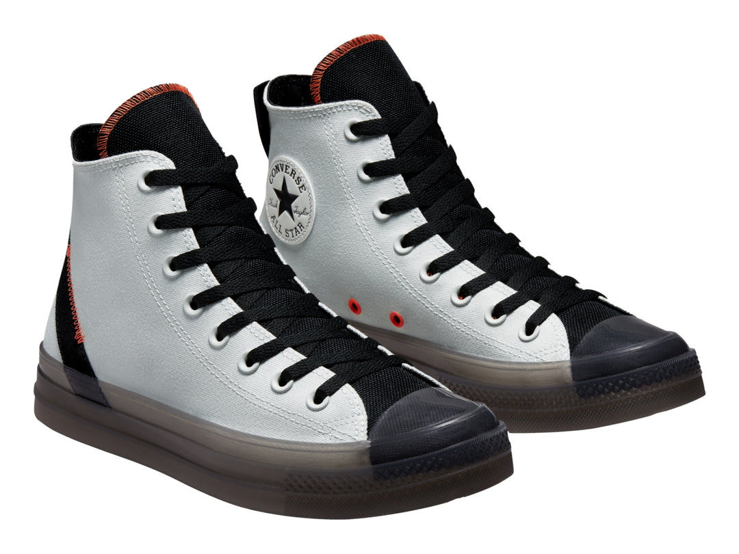 Tenis Converse Chuck Taylor All Star CX color plata con detalles en negro y naranja, corte alto.