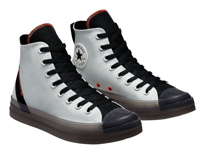 Tenis Converse Chuck Taylor All Star CX color plata con detalles en negro y naranja, corte alto.