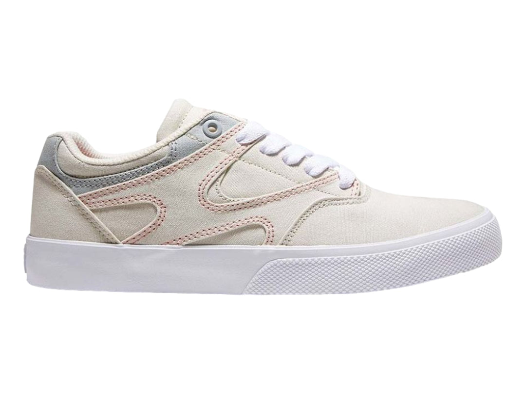 Tenis DC Shoes color beige con detalles en gris y costuras rosas, suela blanca, vista lateral.
