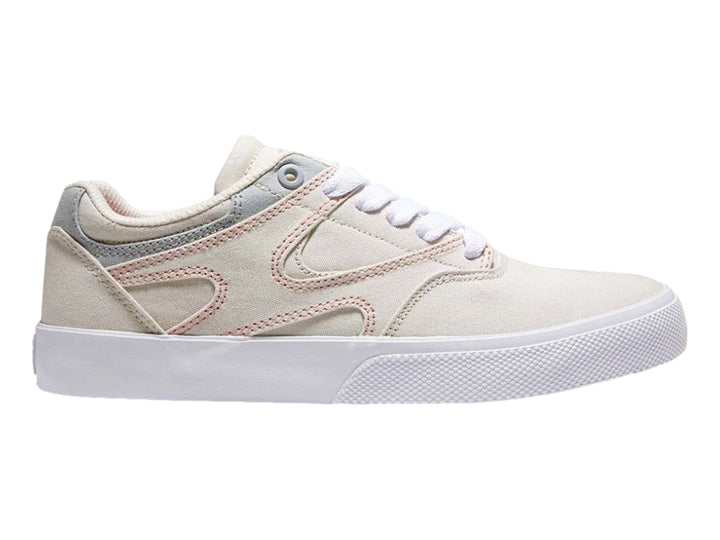 Tenis DC Shoes color beige con detalles en gris y costuras rosas, suela blanca, vista lateral.