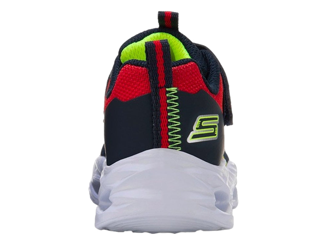 Tenis deportivos Skechers para niño en colores azul, rojo y amarillo con suela blanca robusta y cierre de velcro.