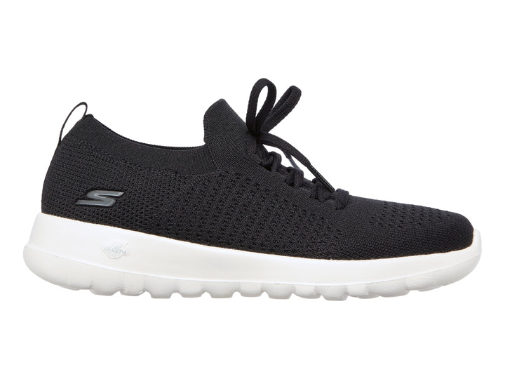 Tenis deportivos Skechers para mujer en color negro con suela blanca y agujetas.